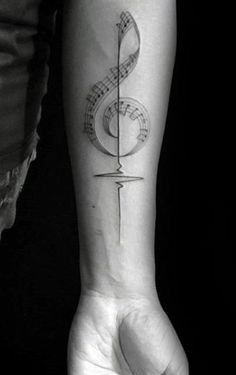 a person with a tattoo on their arm holding a knife and musical notes behind them