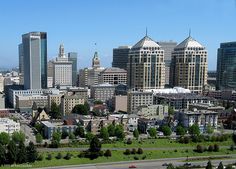 an aerial view of a city with lots of tall buildings