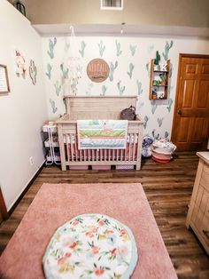 a baby's room is decorated in pastel colors