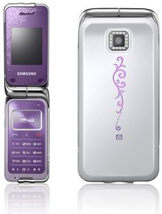 a purple and silver cell phone sitting next to each other