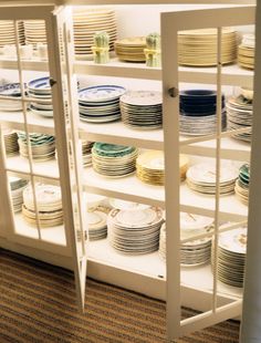 a display case filled with lots of plates