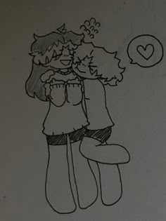 a drawing of two people hugging each other on a piece of paper with the word love written above them