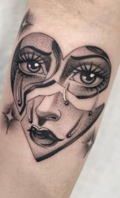 a woman's face with eyes and nose tattoo on the left arm, in black and white