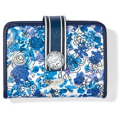 In wonderful shades of blue, highlighted with Italian navy blue leather, this wallet will match every pair of denim jeans you own, and compliment every other color in your closet. - Width: 4 1/4" - Height: 3 1/4" - Depth: 1/2" - Credit Card Slots: 7 - Interior Pockets: 1 - ID Window: Yes - Exterior Material: Leather - Closure: Snap - Exterior Pockets: 1 - Leather items: since this is a natural product, clean and condition regularly. - Silver Hardware: just wipe down with a dry 100% cotton cloth, Chic Blue Rectangular Wallet, Trendy Blue Wallets With Interior Card Slots, Trendy Blue Wallets With Card Slots, Blue Casual Wallets With Rfid Blocking, Casual Blue Wallets With Rfid Blocking, Blue Leather Trifold Wallet For Travel, Casual Blue Rfid Blocking Wallets, Casual Blue Bifold Wallet, Blue Leather Wallet With Rfid Blocking