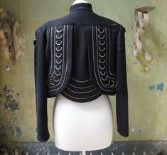 Short black embellished Korii Joko International bolero jacket. Size 3 / size M. Can be worn with a size S a bit oversized. A 1980s geometric designer piece. Black with silver zippers and silver rings all over. Japanese style piece. In good vintage condition, some pill on the jacket. 3 rings a missing in front underneath the figure. The bolero jacket has shoulderpads. Jacket can be washed, I did not wash her. Measurements approx.: length: 43 cm-17 inches. Shoulderseam to shoulderseam: 43 cm-17 i Black Bolero Jacket, Y2k Cardigan, Jourdan Dunn, Multiple Outfits, Denim Inspiration, Bolero Jacket, Avant Garde Fashion, Boston Proper, Silver Zipper