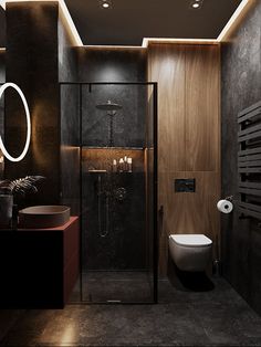 a bathroom with a toilet, sink and shower stall in it's dark color scheme