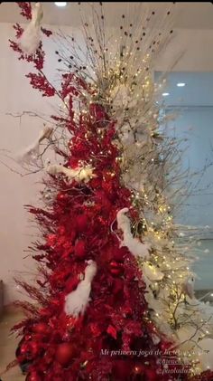 red and white christmas tree with birds on it