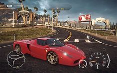 a red sports car driving down a road next to palm trees