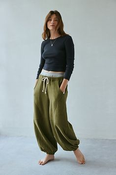 Updated Out From Under sweatpant in a barrel-leg, jogger style. Designed in a so sot fleeced knit featuring a low-rise elasticized waist, drawstring tie and wide barrel legs that cinch at the ankles. Only at Urban Outfitters. Features Out From Under Kai Extreme barrel jogger Barrel leg pant Soft and stretchy fleeced knit Low rise elasticized waist with tie Wide barrel leg Cinched hems Oversized, relaxed fit Cropped length Easy pull-on style UO exclusive Content + Care 58% Cotton, 42% polyester Machine wash Imported Size + Fit Model in Grey is 5'9" and wearing size Small Measurements taken from size Small Waist: 28" Inseam: 26" | Out From Under Kai Extreme Barrel Joggers Pant in Olive, Women's at Urban Outfitters Cheap Urban Outfitters High-waisted Pants, Cheap Sportswear Bottoms With Elastic Waistband, Cheap Full-length Moisture-wicking Bottoms, Boho Sweatpants, Hiking Pants, Fashion Joggers, Women Men Shoes, Coraline, Small Waist