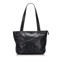 This Chanel CC shoulder bag was made from black Caviar leather. The Bag features CC logo quilting on the front, flat leather shoulder straps, a zipper closure at the top opening, and a zippered compartment inside. The Bag is best loosely over the shoulder. Tote Bag Black, Black Caviar, Fashion Icon, Cc Logo, Early 1900s, Black Tote Bag, Coco Chanel, French Style, Leather Handle