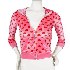 a female mannequin wearing a pink jacket with hearts on it