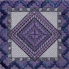 a purple and white square with blue leaves on the bottom, in front of a gray background