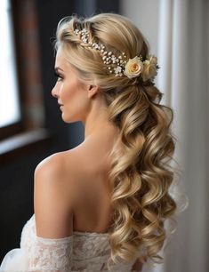 a woman with long blonde hair wearing a flower in her hair is looking off to the side