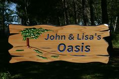 a wooden sign that says john & lilaa's oasis