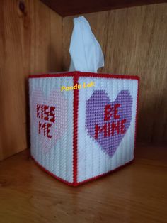 a tissue dispenser that has been made to look like a cube with the words be mine on it