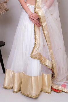 Ivory lehenga set featuring a V neck padded blouse with gold gota hand embroidery, sequin and thread work on half sleeves. Paired with a flared lehenga with attached can-can and a metallic kiran bordered embroidered dupatta., Fit: Relaxed Kiran Dupatta, Work On Sleeves, Ivory Lehenga, Flared Lehenga, Dupatta Border, Blouse Lehenga, Padded Blouse, Embroidered Dupatta, Silk Organza