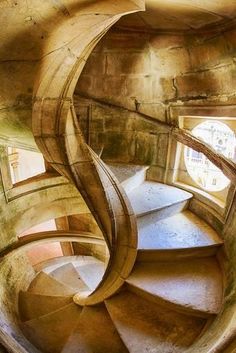 a spiral staircase in an old building