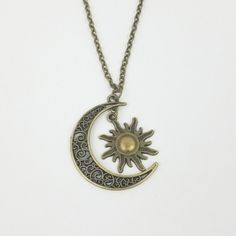 An Awesome Vintage Look Bronze Gold Necklace. Chain Length Roughly 20-22". Unique Filigree Design On The Large Moon With A Dangling Bursting Sun. Moon Overlaps The Sun. Also Available In Silver In Separate Listing. Boho Bohemian Gypsy Night Space Celestial Celtic Swirls Filigree Christmas Holiday Birthday Gift For Her Mom Grandma Daughter Sister Girlfriend Wife Best Friend Fashion Accessories Accessory Jewelry Jewellery Celtic Swirls, Best Friend Fashion, Gold Necklace Chain, Boho Pendant Necklace, Sun And Moon Necklace, Accessory Jewelry, Beach Boho, Moon Sun, Boho Pendant