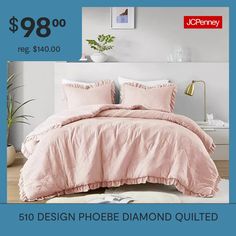 a bed with pink comforter and pillows on it for $ 89 00 reg $ 40 00