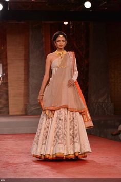 Nayanika Chatterjee walks the ramp for designer Anju Modi on Day 1 of Delhi Couture Week, held in New Delhi, on July 31, 2013. Delhi Couture Week, Red Lehenga Choli, Indian Kurti, Character Costume, Oh My Goddess, Anita Dongre, Ghagra Choli, Indian Couture, Lakme Fashion Week