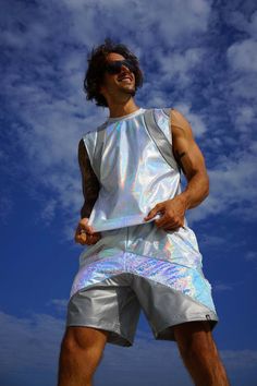 Being happy and holographic never goes out of style! We designed this mens rave tank top for festival outfits and fun times. We promise the Pisces Tank in White Lightning will captivate you (and everyone else) with its outrageously holographic snakeskin pattern and reflective paneling. This mens reflective tank top is ready to rave! We designed this top for mens festival outfits and fun times. FEATURES: -Made with high quality holographic snakeskin spandex fabric -Slightly dropped arm hole -Cont Cheap Men's Shirt For Festival, Cheap Men's Festival Shirt, Alien Outfit Men, Male Rave Outfits, Men Rave Outfits, Mens Rave Outfits, Mens Festival Fashion, Rave Men, Rave Outfits Men