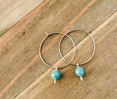 These green aventurine  hoop earrings are so cute!  The pretty green charms come on 30 mm stainless steel hoops.  The simple hoops are so stylish with this semiprecious bead.  These same hoops come in 10 other gemstones in the shop.  This minimal earring is just the thing to add to your wardrobe. ~I use high quality hypoallergenic materials along with many different colors and types of beads.  I work hard to create beautiful pieces and to provide excellent customer service.   Packaging All of my Green Charms, Boho Hoop Earrings, Minimal Earrings, Agate Earrings, Earring Gift, Earrings Beaded, Pretty Green, Jewelry Earrings Hoops, Green Aventurine