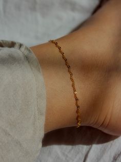 You'll love the delicate shine of this anklet! A simple sparkly chain dipped in 18k gold over stainless steel shape this simply stunning ankle bracelet. Ideal for stacking with other anklets or wear it by itself. MATERIALS & SIZE Material: 18k stainless steel Size: 8, 8.5, 9 or 9.5 in. chain + 1 in. extender Closure: Toggle clasp JEWELRY CARE Most of our jewelry is tarnish resistant, hypoallergenic, safe for sensitive skin. Handmade with ♡ in New York. - To maintain the beauty of your jewelry, w Anklet Stack, Gold Chain Anklet, Functional Jewelry, Gold Anklet, Ankle Chain, Ankle Bracelet, Chain Anklet, Trendy Jewelry, Toggle Clasp