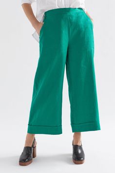 Product Details Linen culotte. Made from 100% French linen, the Vassa Culotte features a flat front waistband, angled front pockets and faux cuff detail for a casually tailored look. Elasticated at the back of the waist for comfort, this slightly cropped pant also has an internal tie to adjust the waist to fit. Easy, pull-on style with an elastic back waistband Tie in the internal front waistband Wide leg with an exaggerated faux cuff detail Crafted from 100% French linen Similar cut to our popu Aloe Green, Regions Of France, Garment Factory, Cuff Detail, Great Team, Ankle Bones, French Linen, Small Crossbody Bag, Small Crossbody