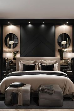 a bedroom with black walls and white bedding, mirrors on the wall above it