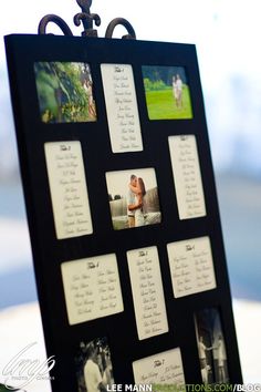 a black and white photo frame with pictures attached to the side, on top of a table