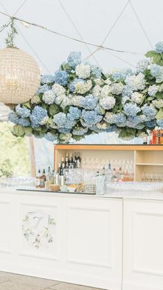 the bar is decorated with blue and white flowers