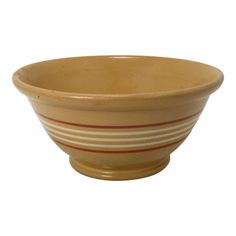 a bowl with red and white stripes on the bottom is sitting in front of a white background