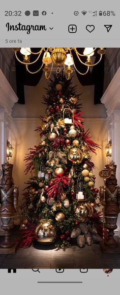 a christmas tree is decorated with gold and red ornaments