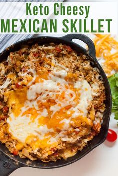 mexican skillet with cheese and meat in it on a white plate next to lettuce