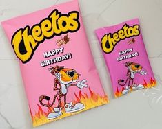 two bags of cheetos candy sitting on top of a white countertop next to each other