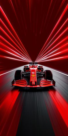 a red race car driving through a tunnel with bright lights on the side and behind it's front wheel