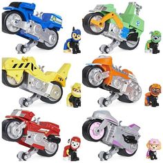 a bunch of toys that are in the shape of cars and motorcycles on a white background