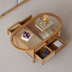 a coffee table with two drawers on the bottom and an open drawer in the middle