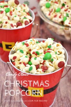 two red buckets filled with christmas popcorn