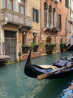 a gondola on the side of a canal in venice