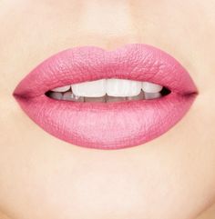 a woman's lips with white teeth and pink lipstick