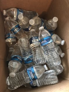 a cardboard box filled with bottled water