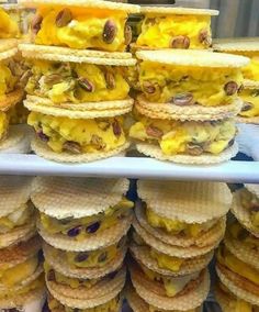 there are many waffles stacked on top of each other with different toppings