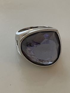 This is a gorgeous large chunky modernist statement ring from Paris. Free form amethyst crystal is faceted and set into a sleek and substantial setting. Sterling silver, marked SS.  Magnificent. Size 7.25. Normal wear. Shipped with care. Modern Crystal Ring With Large Stone, Modern Silver Amethyst Gemstone Ring, Amethyst Crystal, Purple Amethyst, Vintage French, Statement Ring, Rings Statement, French Vintage, Statement Rings