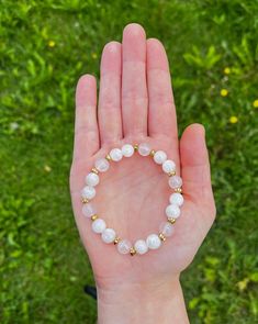 A simple but beautiful piece, this bracelet is made with 8mm Moonstone and Rose Quartz. Created for healing the heart space and creating a harmony of energy within the body. Complimented with brass spacers and strung onto elastic for comfort. Rose Quartz Beaded Bracelets For Meditation, Adjustable White Rose Quartz Beaded Bracelets, White Rose Quartz Beaded Bracelets With 8mm Beads, Adjustable White Rose Quartz Crystal Bracelet, White Rose Quartz Beaded Bracelets With Round Beads, White Rose Quartz Beaded Bracelet With 8mm Beads, White Rose Quartz Bracelets With 8mm Beads, White Rose Quartz Beaded Bracelets For Healing, White Rose Quartz Beaded Bracelets