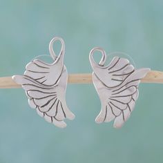 Sterling wings intertwine their soaring grace captured by master silversmith Gianluca Anzani in Mexico. Inspired by Art Nouveau designs the earrings are crafted by hand and combine the best of antique and contemporary fashion. 0.925 Sterling silver Winged Sterling Silver Earrings In Silver, Silver Winged Sterling Silver Earrings, Silver Sterling Silver Winged Earrings, Dove Wing, Silver Bird, Silver Button, Art Nouveau Design, Sterling Silver Drop Earrings, Bird Earrings