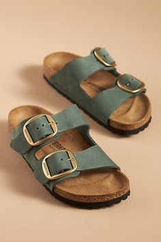 The iconic Arizona sandal features two adjustable straps and a cork footbed for unsurpassed comfort and timeless style. You’re a shoe -in for incredible style and comfort when you slip on Birkenstock®. (P.S. it’s our favorite step when putting together an OOTD)! | Arizona Big Buckle Nubuck Sandals by Birkenstock in Green, Women's, Size: 36, Leather/Metal/EVA at Anthropologie Arizona Travel Outfits, Birkenstock Arizona Big Buckle, Arizona Big Buckle, Frock And Frill, Mum Fashion, Comfort Shoes Women, Oxford Heels, Aesthetic Shoes, Birkenstock Arizona