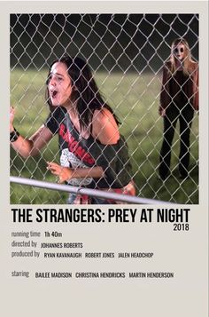 the strangers - prey at night poster is shown behind a chain link fence, with two women in the background