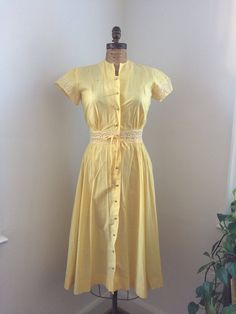 "Super sweet yellow 1940's/50's dress! Has some spots I believe rust from the pearly buttons base. I think while it was stored the rust made contact. Selling as is. I have not tried to remove the spots. Measurements taken flat: 19\" across chest 14\" waist 15.5\" shoulder seam to seam 46\" length" Angelcore Fashion, 70s Disco Dress, Edwardian Fashion Dresses, 1940 Dress, Sun Morning, 1940s Looks, Bright Yellow Dress, Church Fits, Thrift Inspo