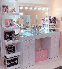 a white vanity with lots of makeup on it